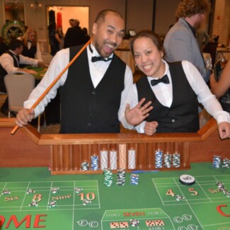 man and women behind casino table